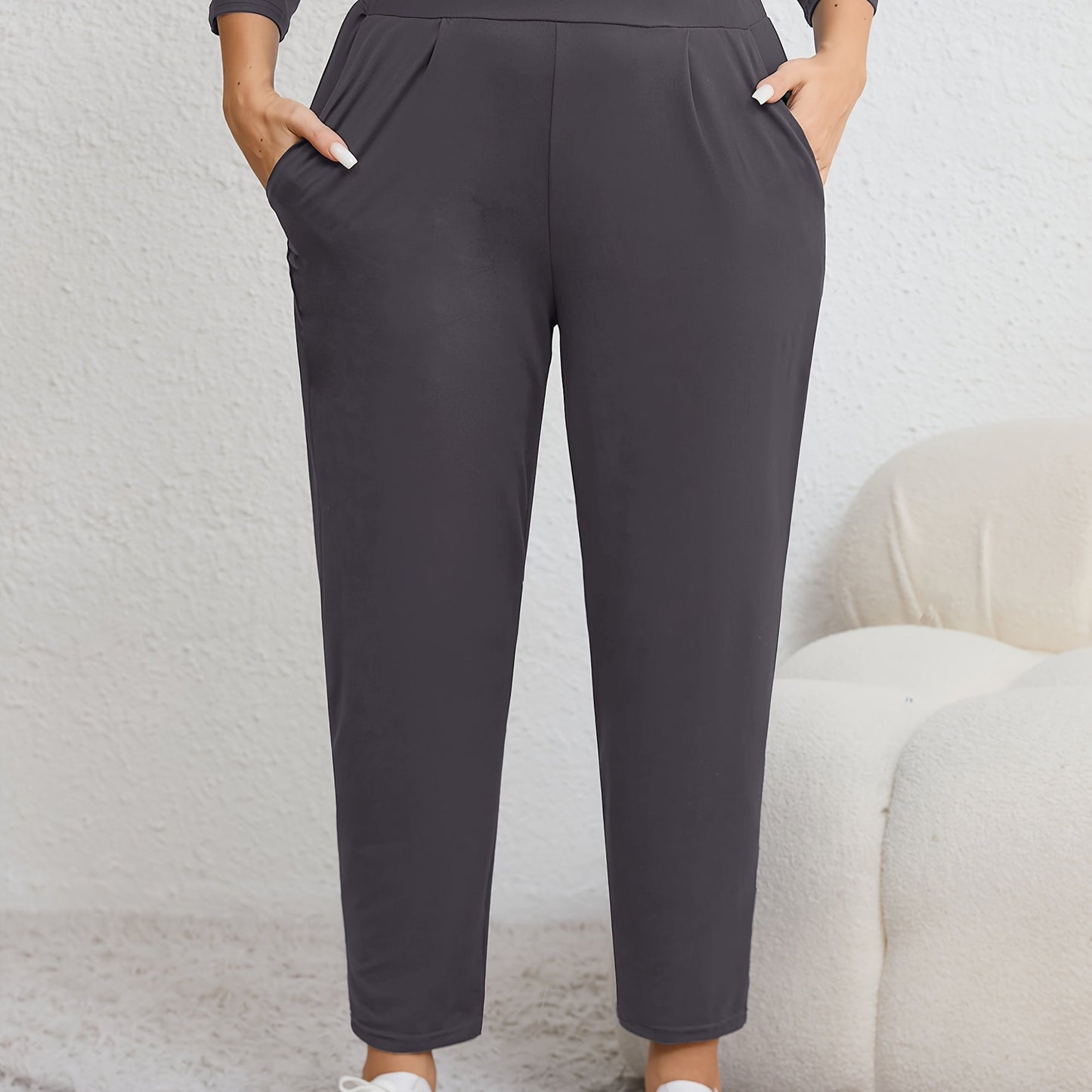 Plus size women's harem pants with high elasticity, ruched waist, pockets, and versatile for all seasons.