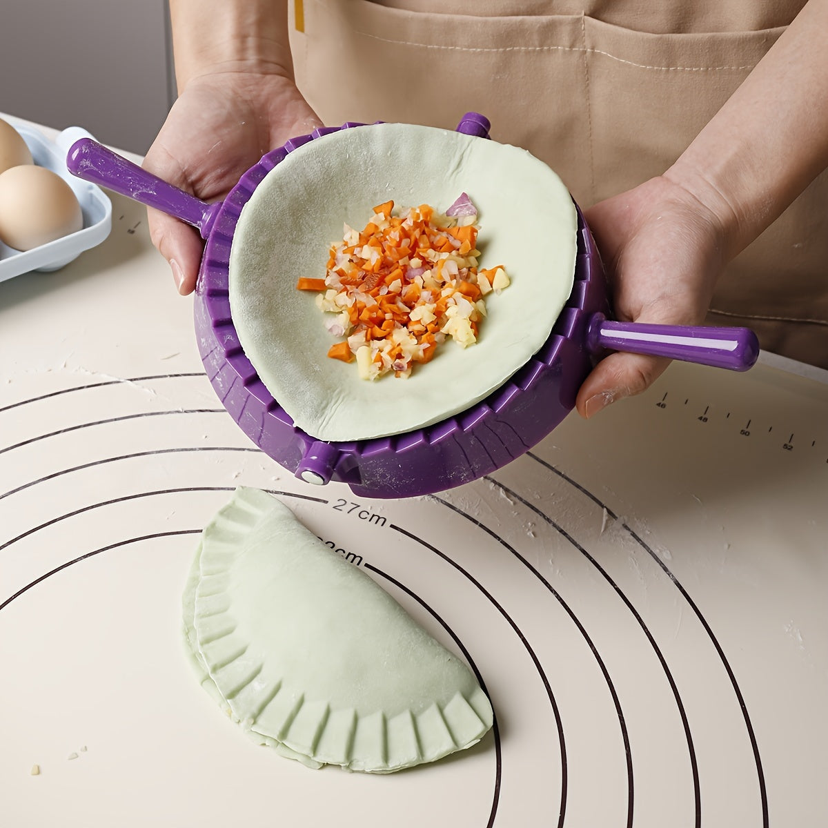 One piece of a plastic dumpling maker, also known as a dumpling mold or manual dumpling wrapper. This versatile kitchen gadget can also be used as an empanada maker and comes with kitchen accessories.