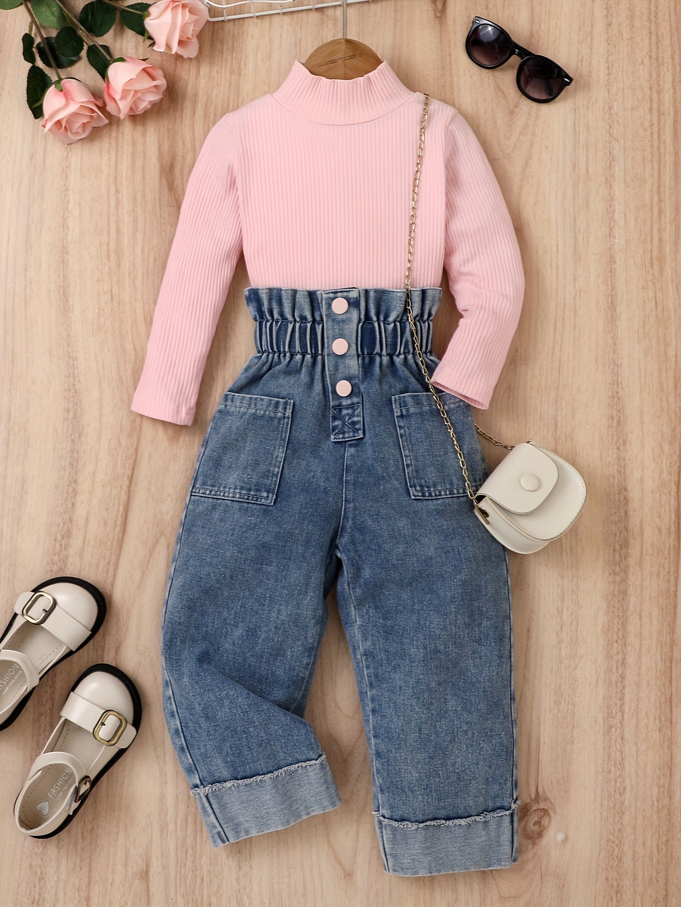 Girl's cotton denim pantsuit includes denim pants and a striped cotton long sleeve top.