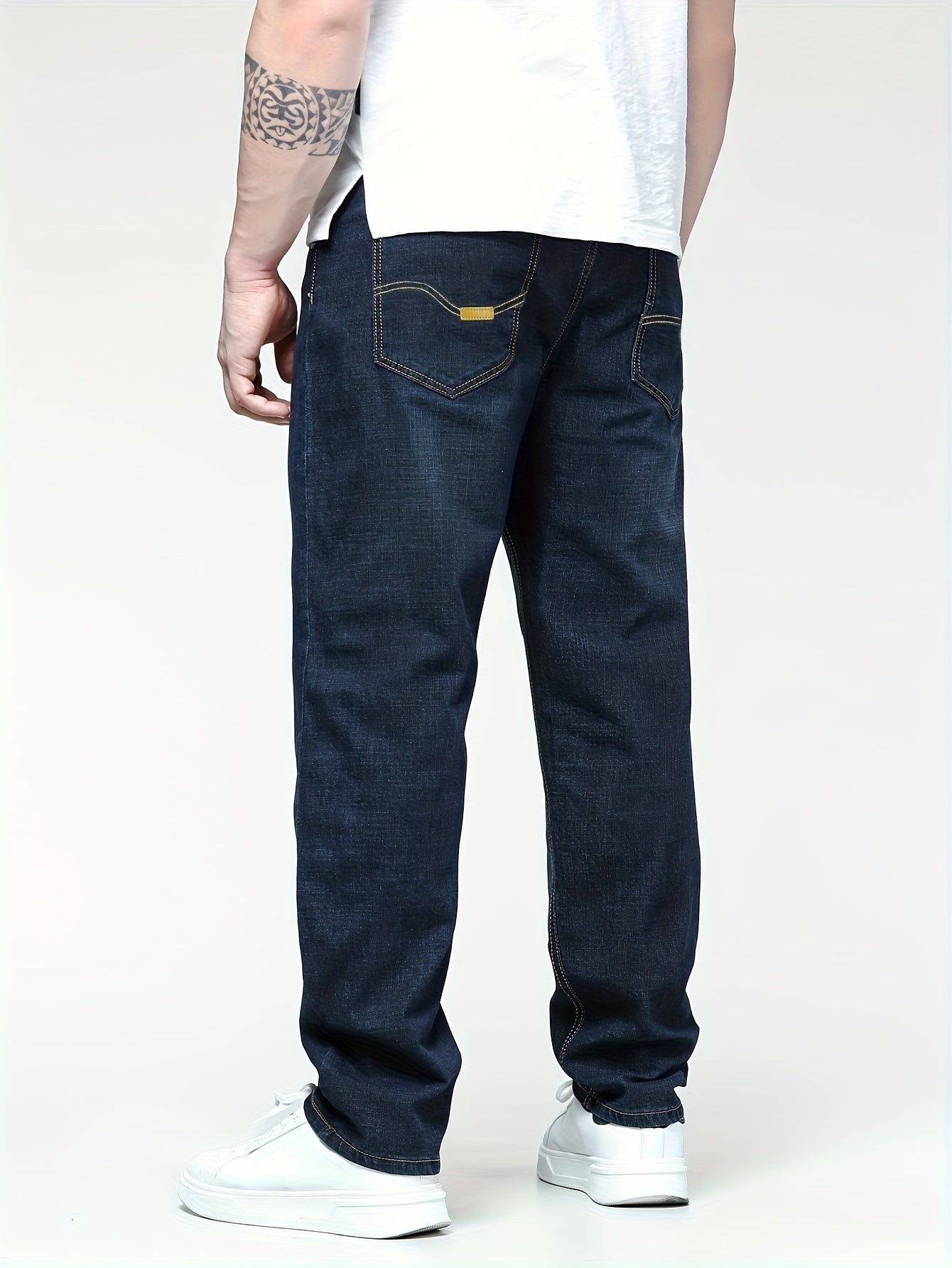 Men's solid denim pants for spring and fall in plus sizes.