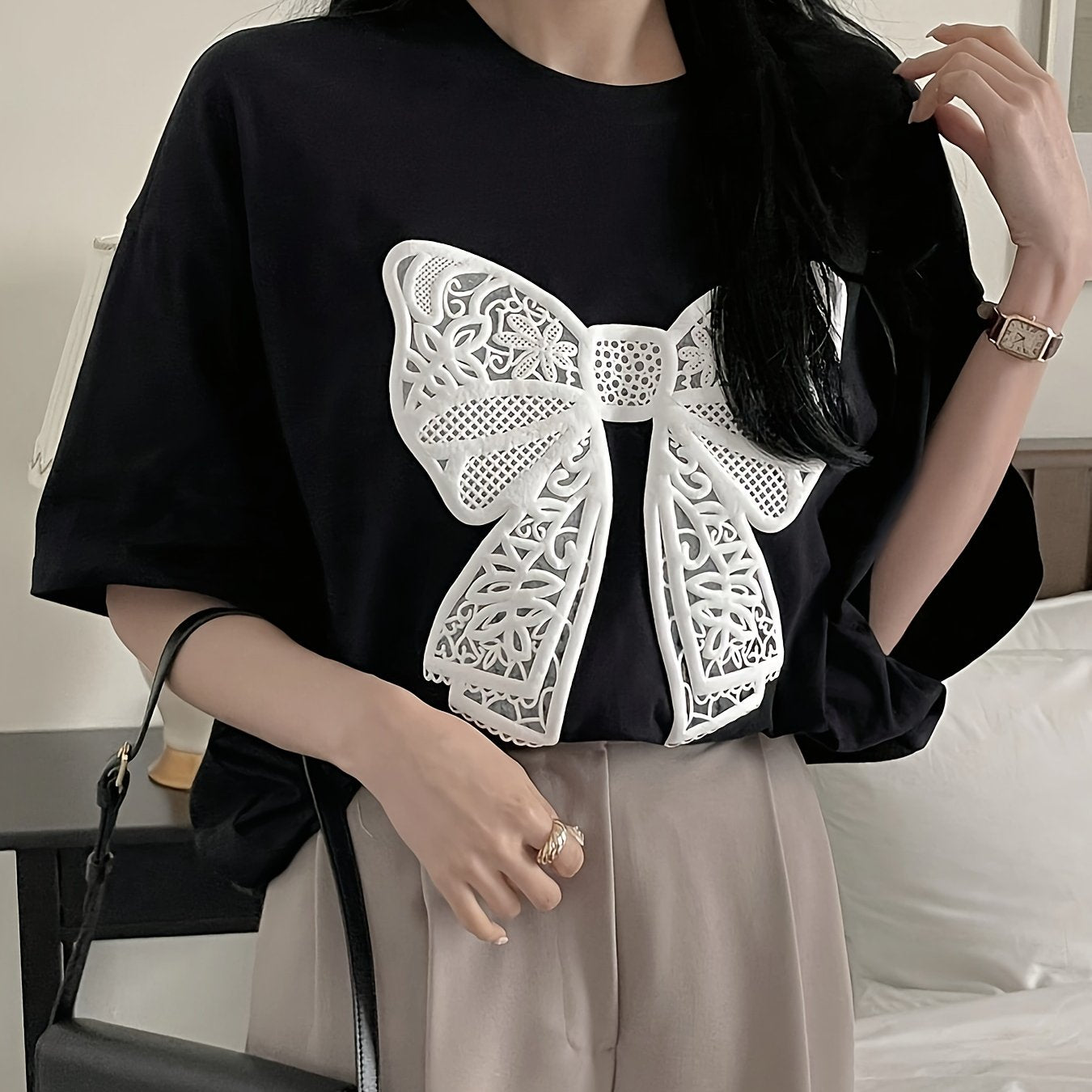 Women's casual crew neck t-shirt with lace bow pattern for spring and summer.