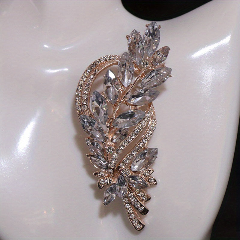 Add a touch of sophistication with our Rhinestone Leaf Brooch Pin - Exquisite design for your dresses and sweaters