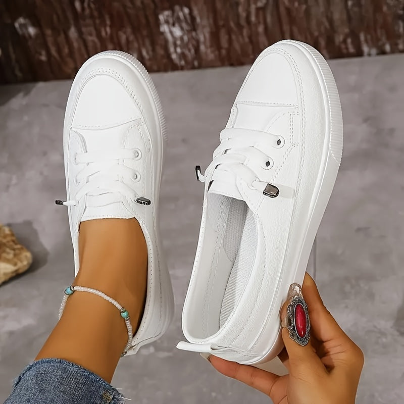 White slip-on sneakers for women, perfect for everyday wear.