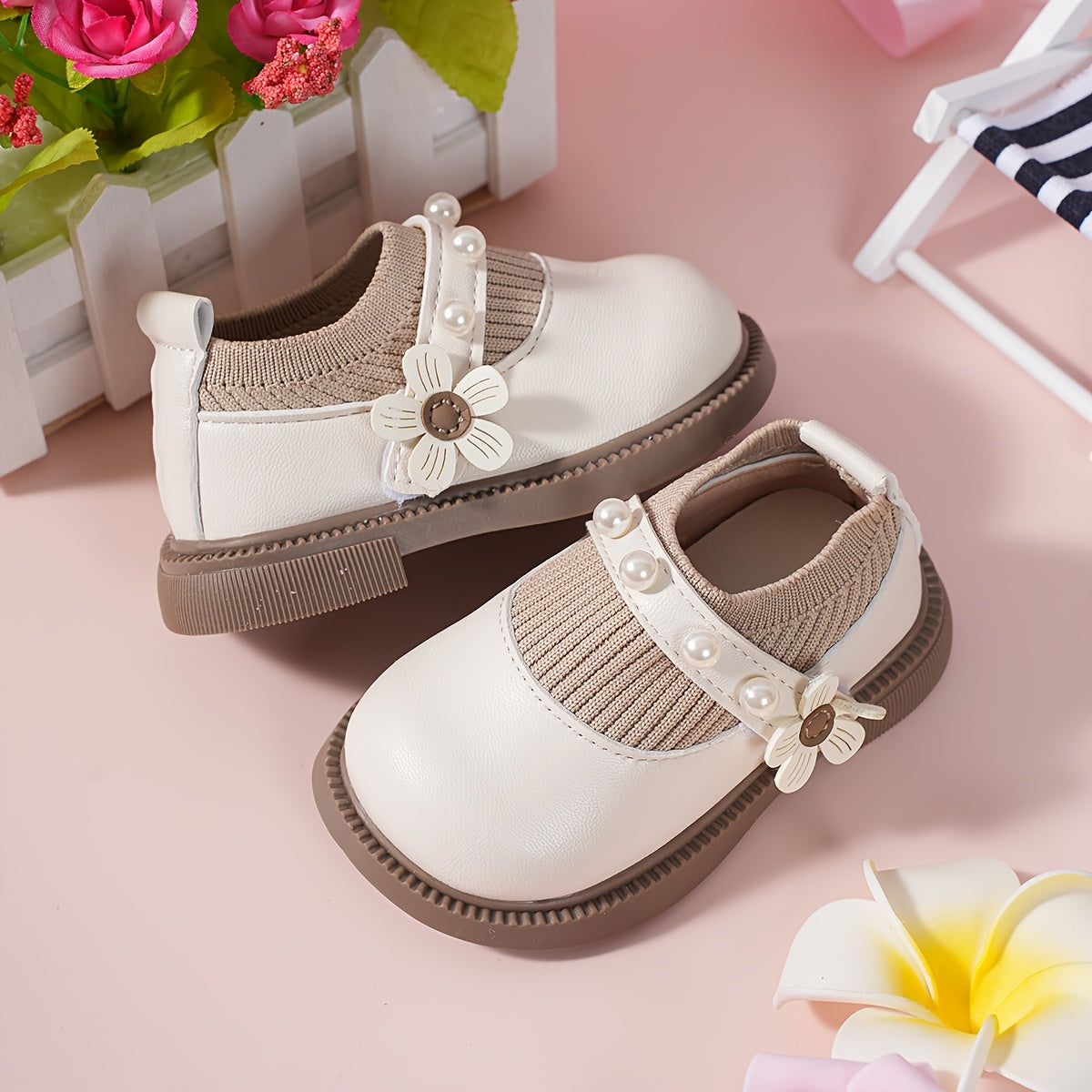 Pair of stylish baby shoes with flower bead accents, perfect for all seasons, including princess flats.