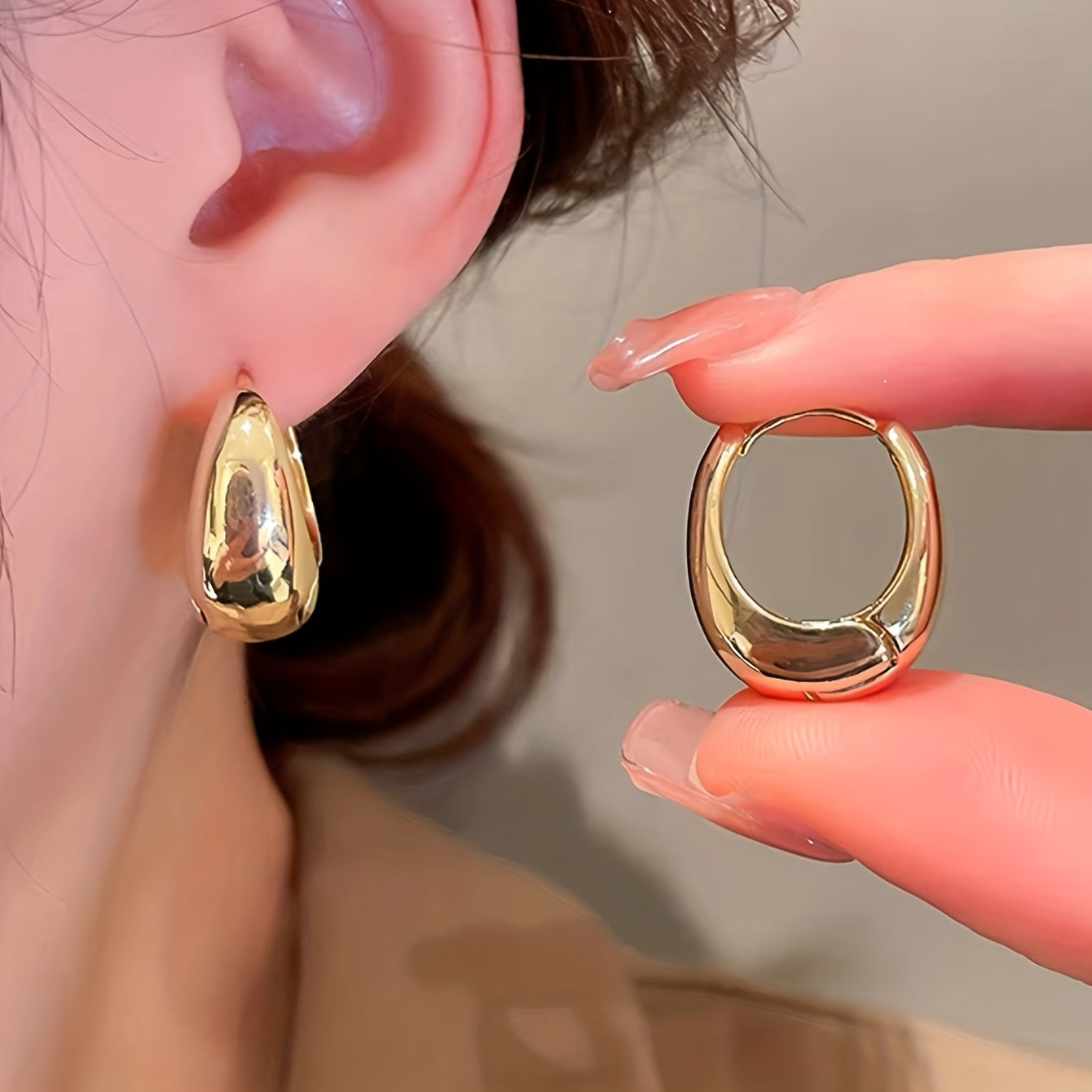 Elegant geometric hoop earrings for women made of copper. Suitable for daily wear, all seasons. Polished finish for a sophisticated look.