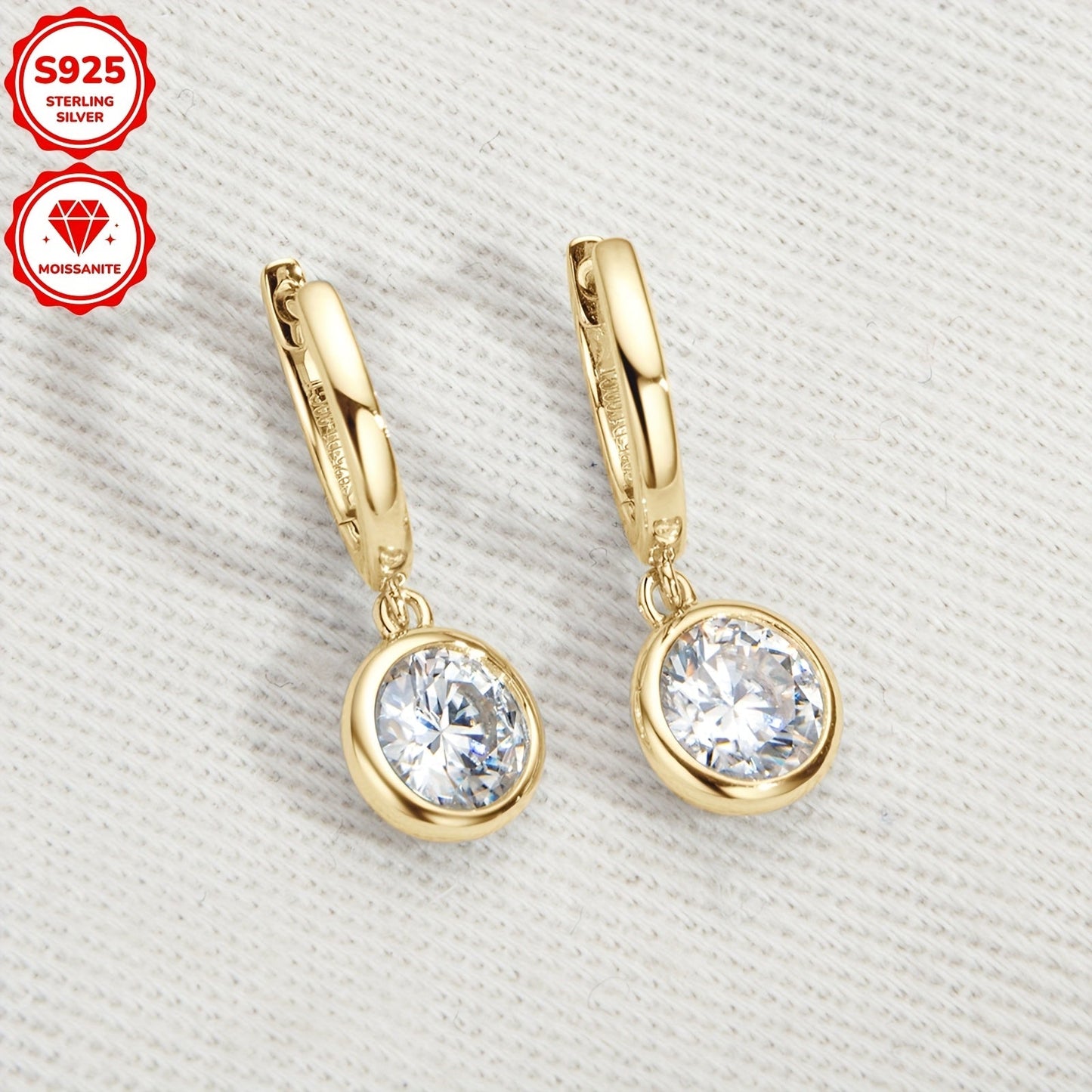 Pair of elegant Moissanite earrings with a silvery gram weight of 2.52g. Featuring two 6.5mm Moissanite stones totaling 1.0 carat each, set in 925 Sterling Silver. These round Moissanite earrings are perfect for adding a touch of glamour to any outfit