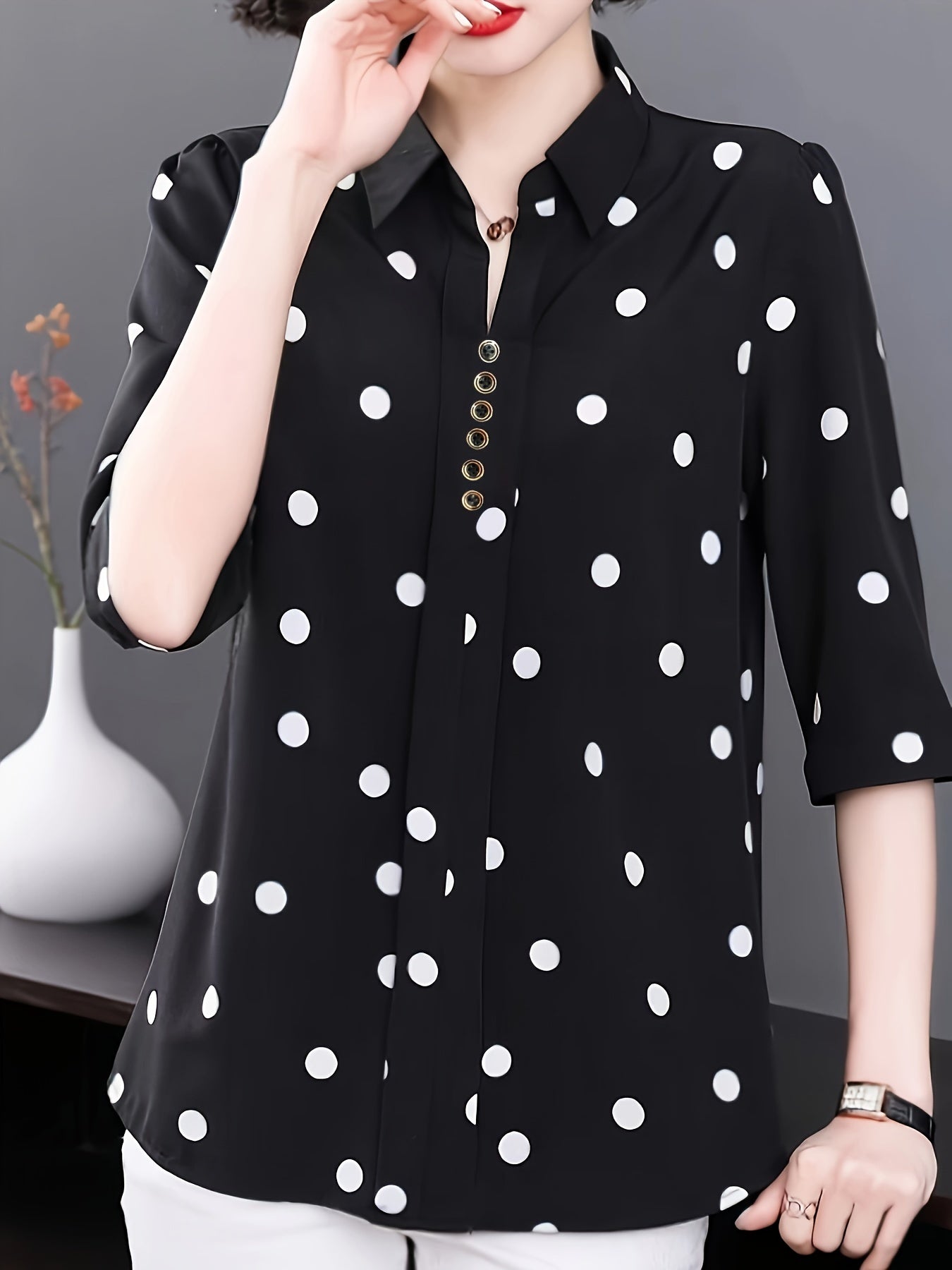 Stylish polka dot blouse for women - perfect for summer vacations. Made of polyester and machine washable with button detail. Non-stretch fabric.