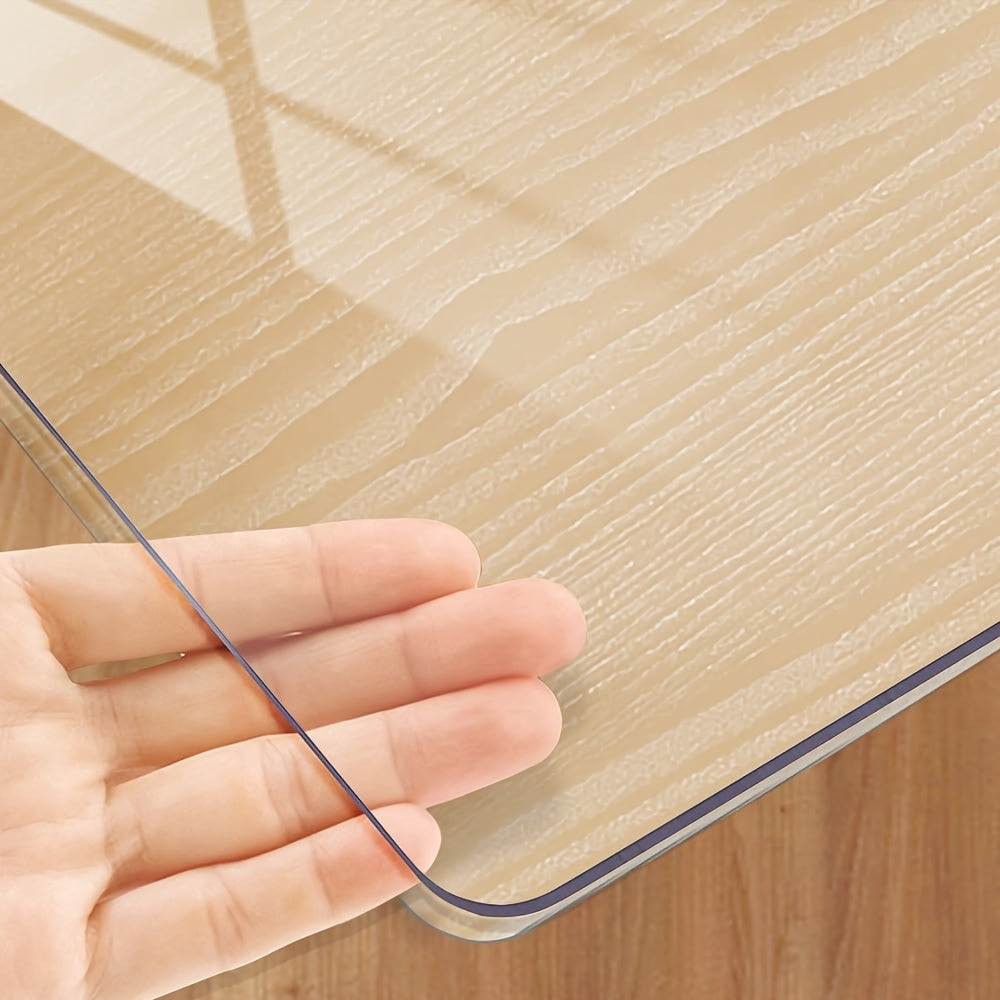 Handmade 1.0mm thick clear PVC tablecloth protector with scratch and heat resistance for home, hotel and coffee tables.