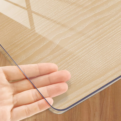 Handmade 1.0mm thick clear PVC tablecloth protector with scratch and heat resistance for home, hotel and coffee tables.