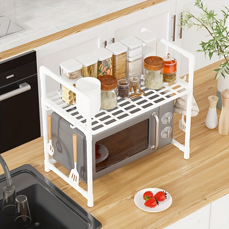 Double-layer kitchen storage rack with 4 hooks and adjustable plastic microwave rack. Convenient open storage suitable for countertops and cabinets, no assembly needed. Perfect for organizing kitchen utensils.