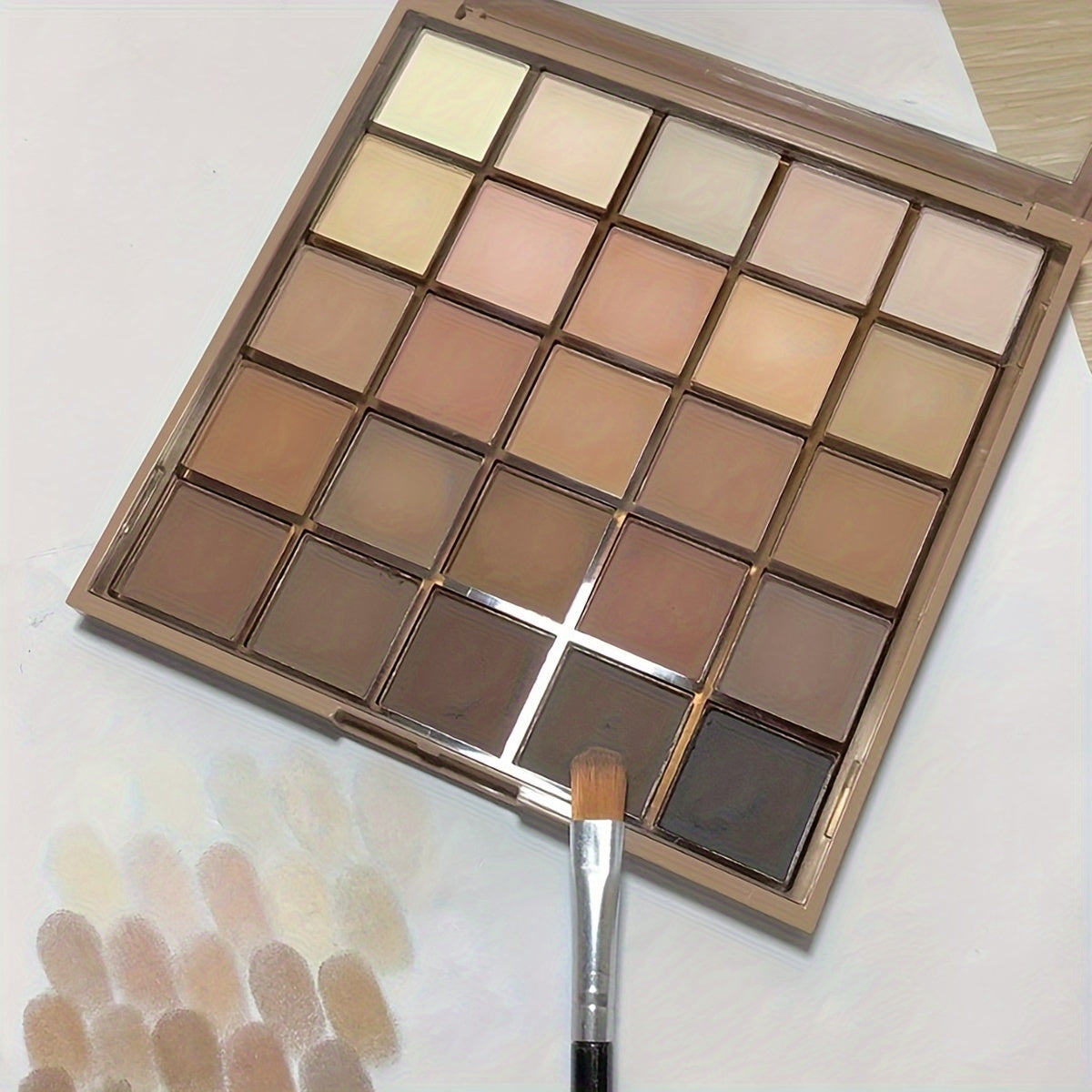 Eyeshadow Palette with 25 matte shades in neutral grey and brown earth tones for versatile makeup looks inspired by coffee and chocolate.