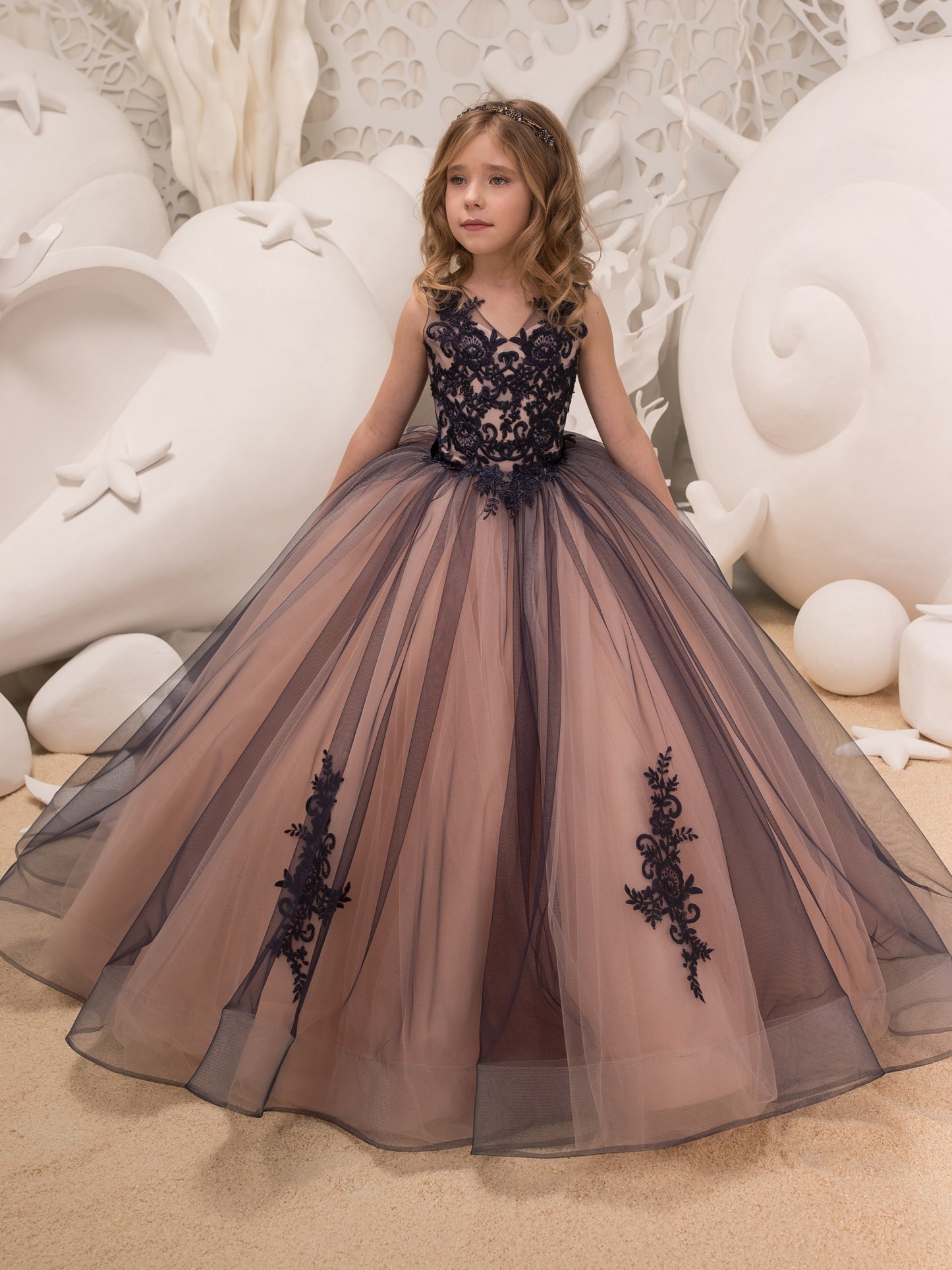 Sleeveless girls' gown with floral appliqué, perfect for performances and piano recitals.