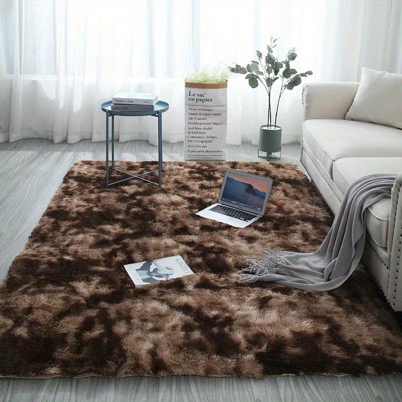 Soft plush area rug, perfect for any room in your home! This non-slip fuzzy shag rug is ideal for adding a touch of luxury to your bedroom or living room. The tie-dyed design adds a unique and stylish touch to your decor. Made with pet-friendly