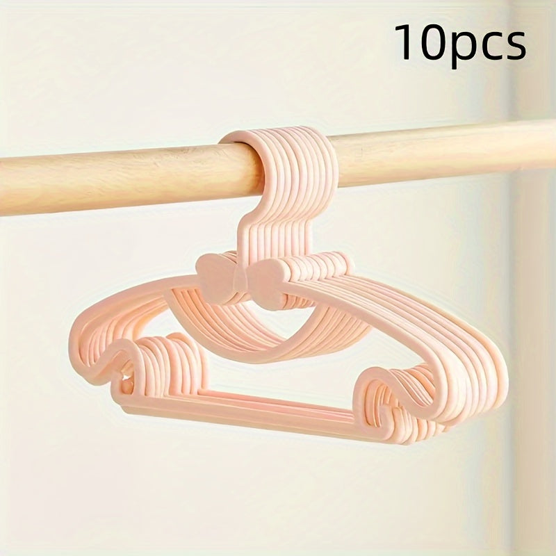 10-piece set of sturdy plastic hangers for kids' clothing - features anti-slip design and space-saving storage solution for children's wardrobes and dorm rooms.