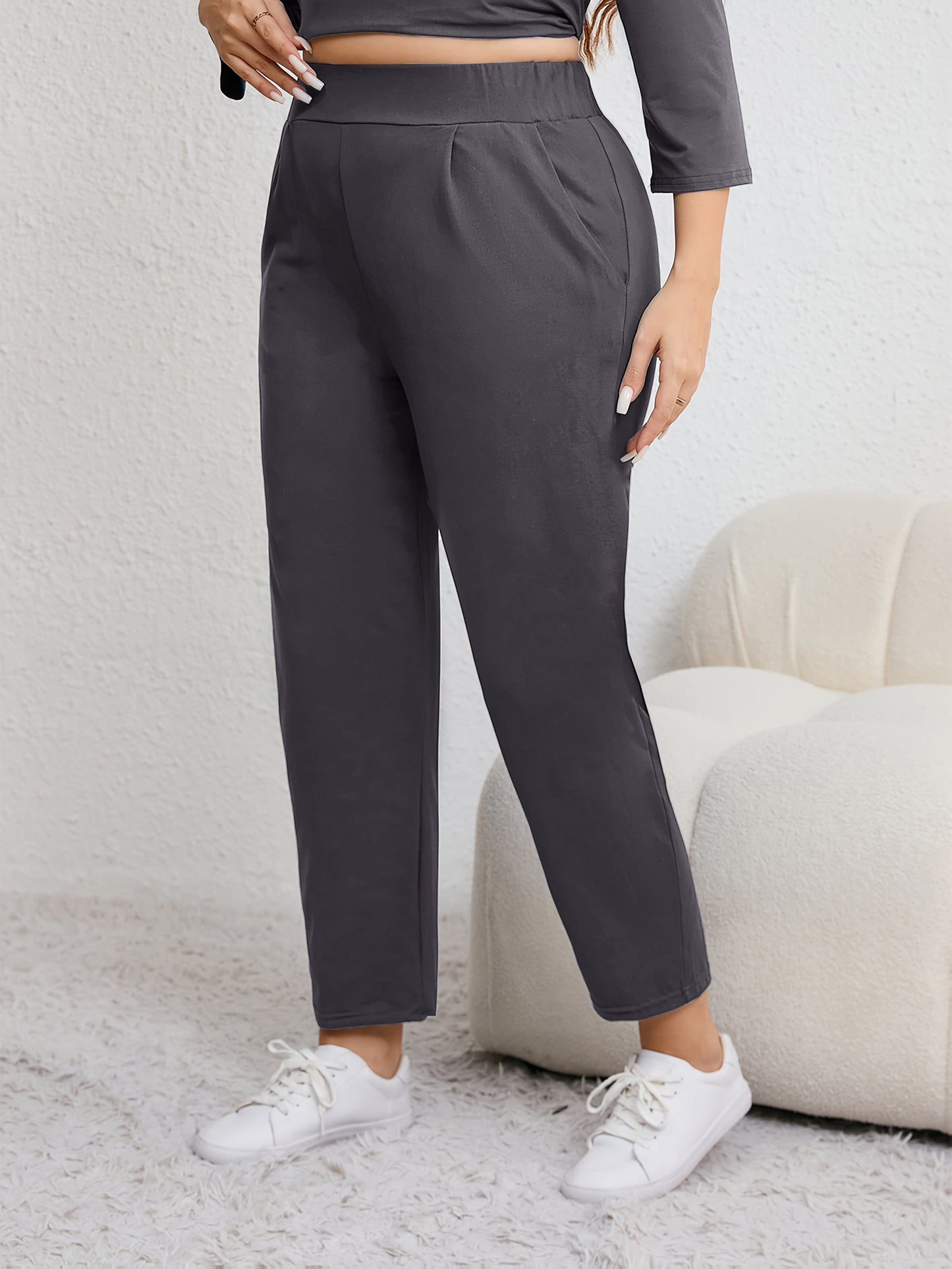 Plus size women's harem pants with high elasticity, ruched waist, pockets, and versatile for all seasons.