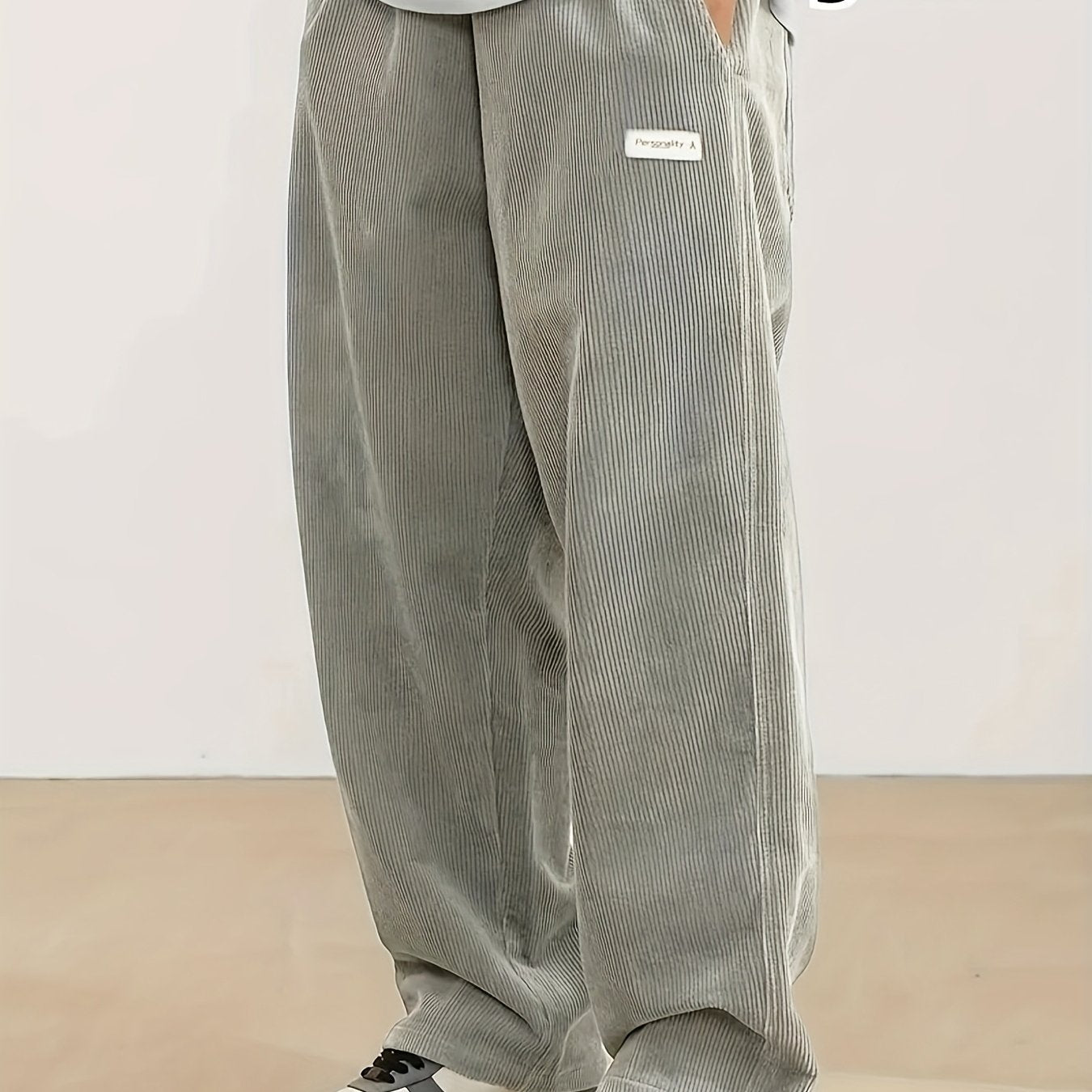 Men's plus size corduroy pants with pocket detail for fall/winter, featuring a letters print.