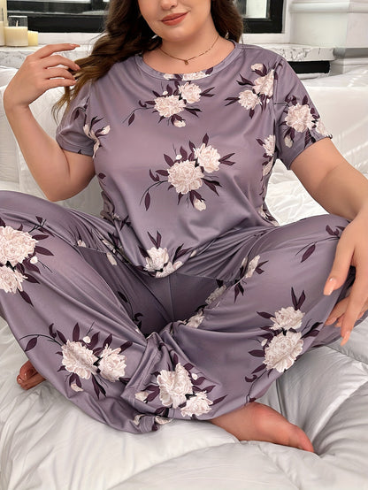 Plus size floral print pajama set for women, including short sleeve top and pants.