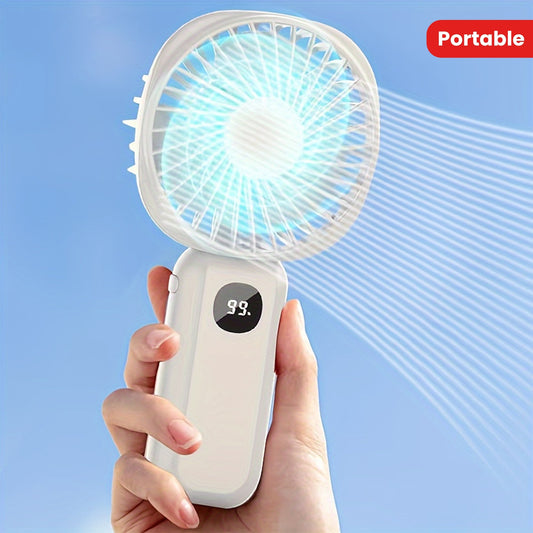 This portable handheld fan features a built-in battery capacity display and can be powered by USB or batteries. It also doubles as a convenient phone holder and is compact and easy to transport. Perfect for both handheld and desktop use, this fan is a