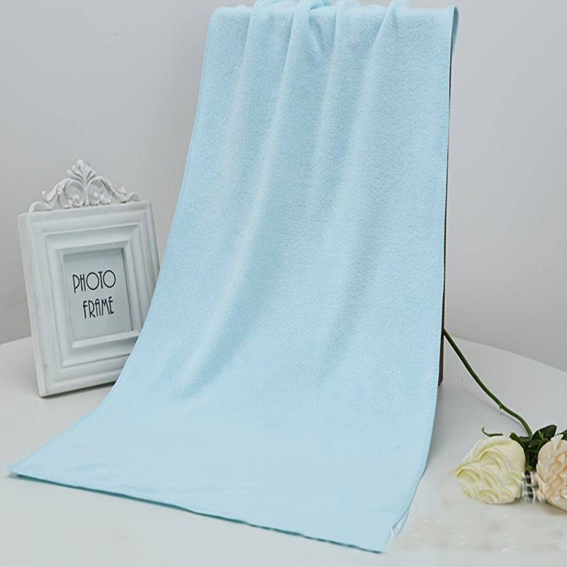 Soft microfiber bath towel with quick dry and absorbent features for use at home or in the spa, featuring a modern cloud pattern design.