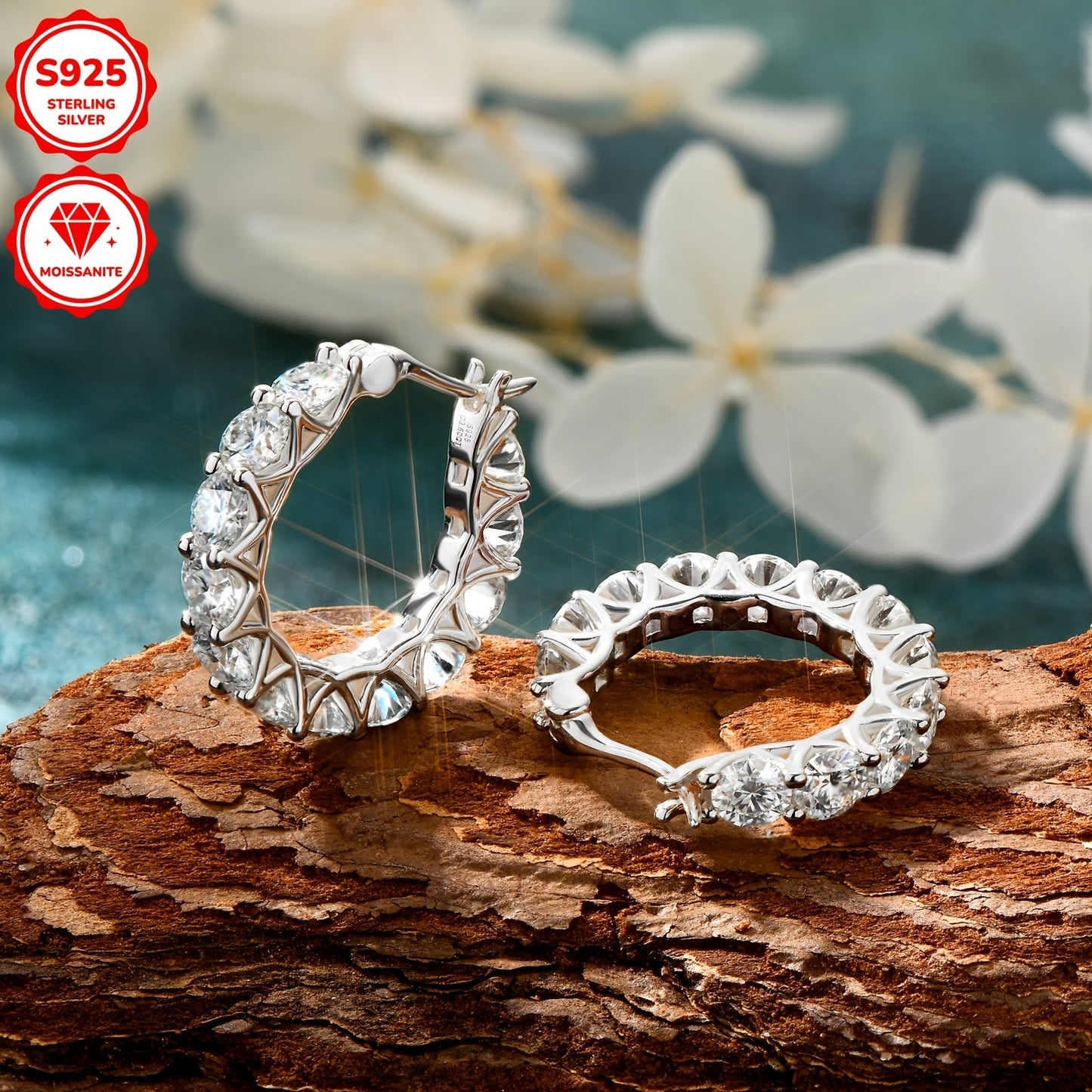 A pair of stunning Moissanite earrings crafted in 925 sterling silver feature a full circle round design with 3mm and 4mm Moissanite stones. The row set earrings have an inner diameter of 13mm, making them the perfect addition to any jewelry collection.