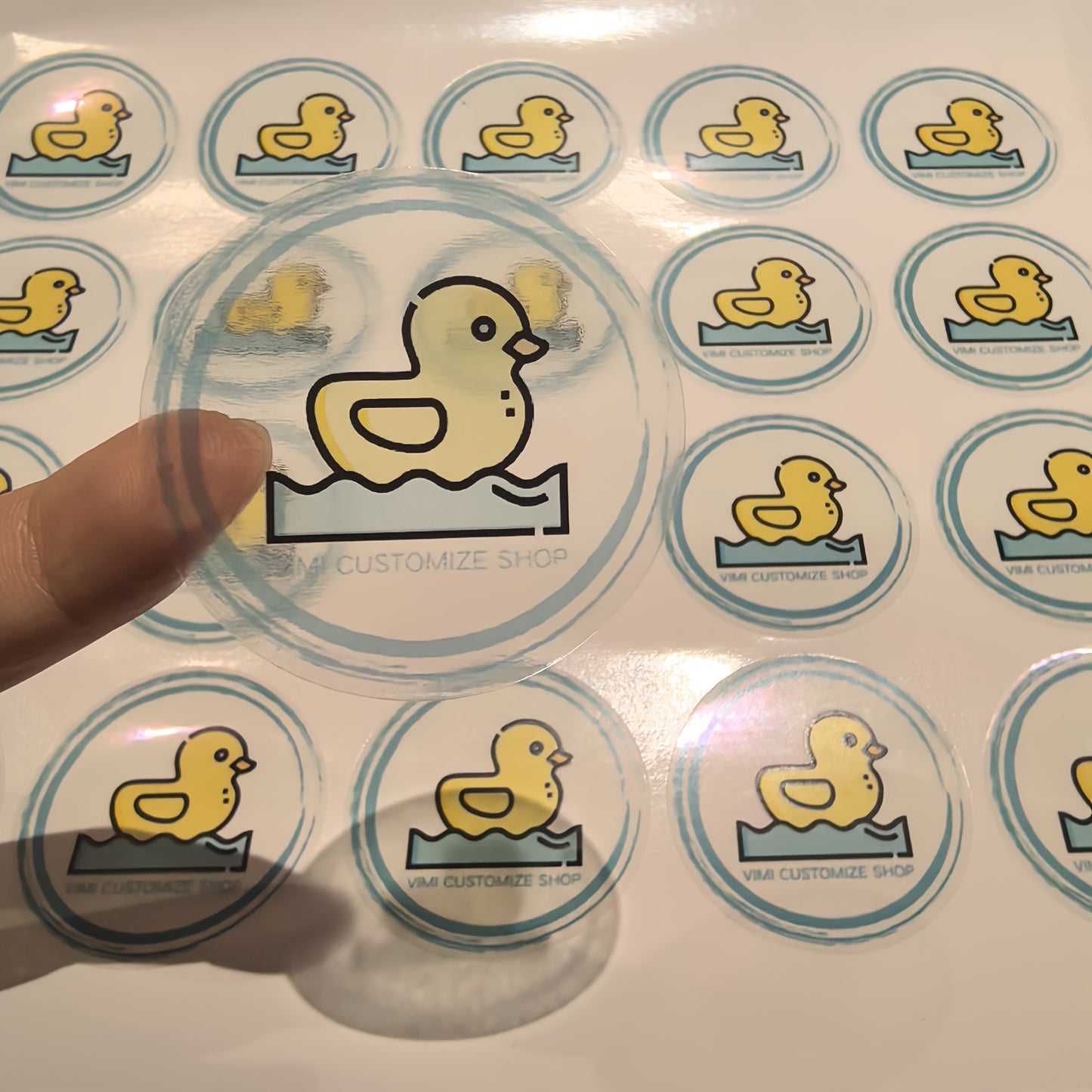 Custom stickers measuring 3.99 cm in size are available in waterproof PVC transparent and white bottom PP paper materials. These stickers can feature your logo, wedding or birthday designs, personalized labels for Christmas and Halloween gifts, or small