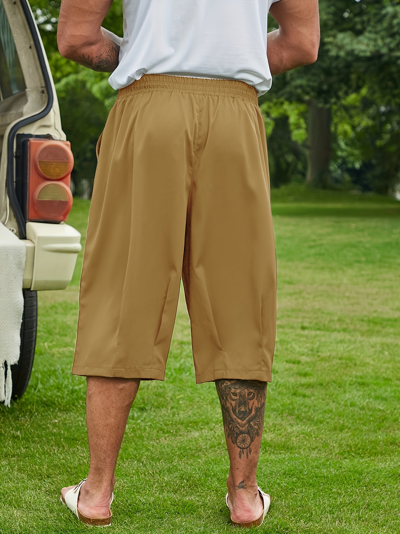 Breathable loose-fit solid capri pants for plus-size men, perfect for summer.