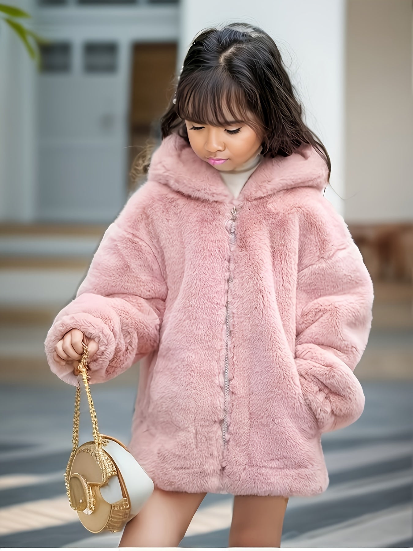 Kid's faux mink fur coat with bear ears hood for warmth in cold weather.