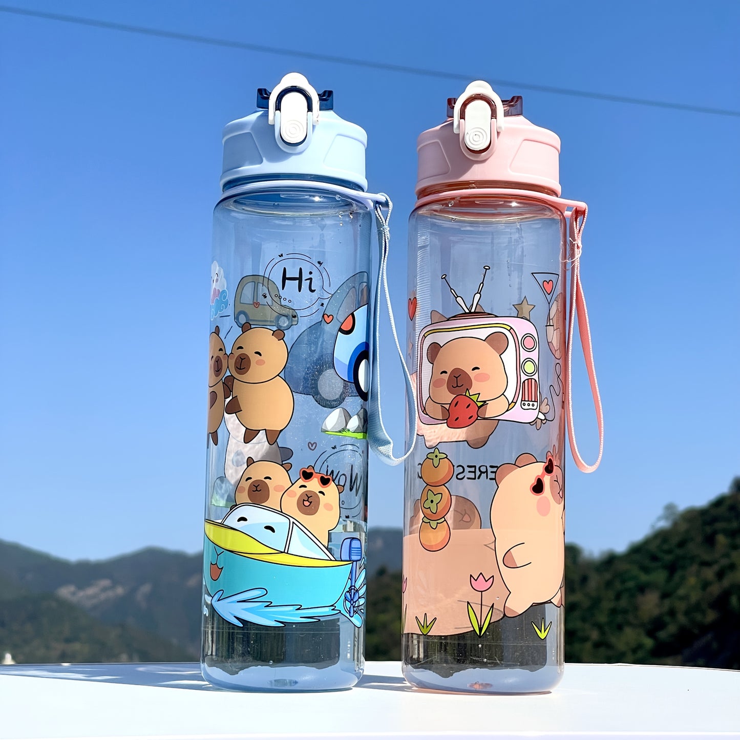 Adorable large sports water bottle with whimsical designs. Durable and portable, perfect for outdoor activities.