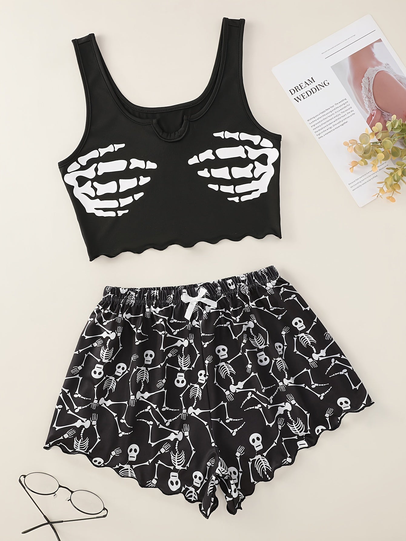 Skull print pajama set with lettuce trim tank top and shorts for women's loungewear and sleepwear at a music festival.