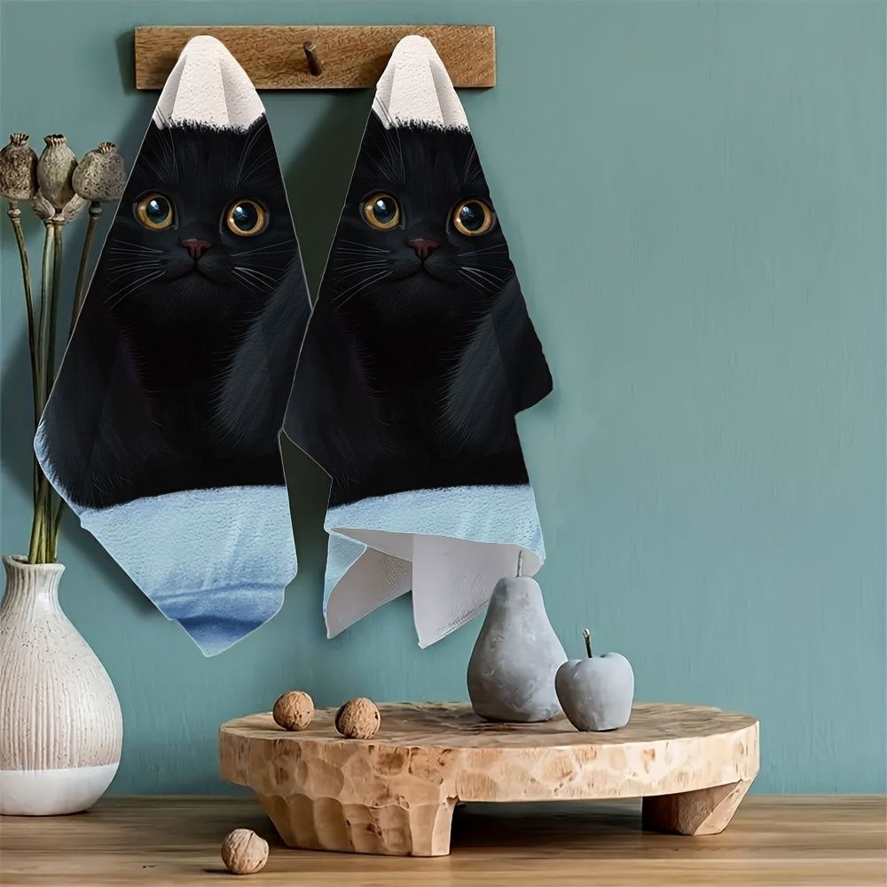 This pair of ultra-soft kitchen towels showcases a black cat stretching on a pillow, with its front paws and pink claws on display. These highly absorbent dish towels are ideal for holiday decoration and can be easily machine washed. The towels measure