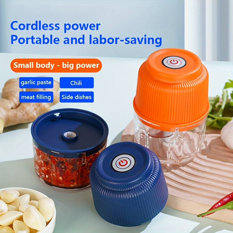 Portable electric garlic mincer with stainless steel blades; also functions as a chili crusher and food processor. Features USB charging, 500mAh lithium battery, and anti-splash design.