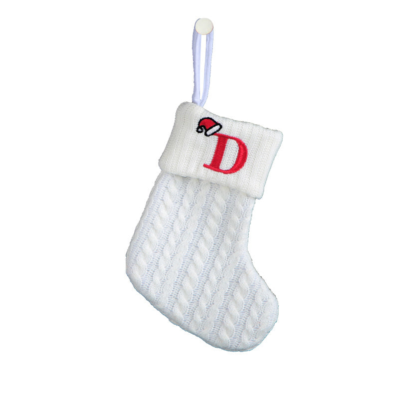 White cable knit stocking with embroidered 'F' - Ideal for indoor decor.