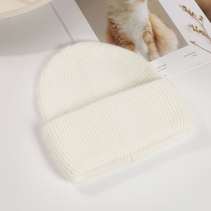 Soft knit beanie in candy colors for women, perfect for casual wear in autumn and winter.