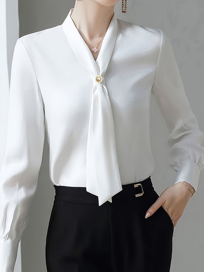 Stylish V-neck shirt with bow tie decoration for women, made of 100% polyester. Regular fit with single breasted placket. Woven fabric, suitable for all seasons.