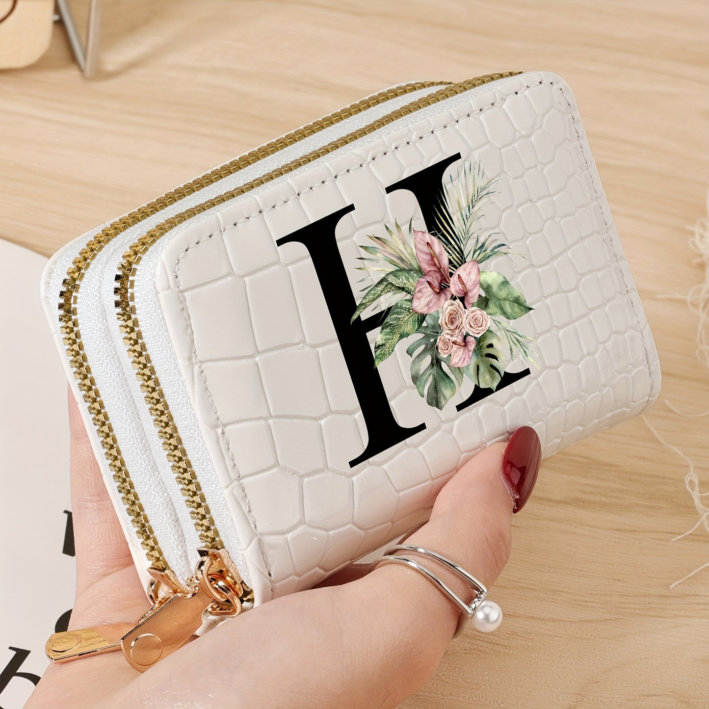 Women's credit card wallet with elegant floral letter print in black & white. Features large capacity, dual zipper, crocodile texture PU, lightweight design with nylon lining for everyday