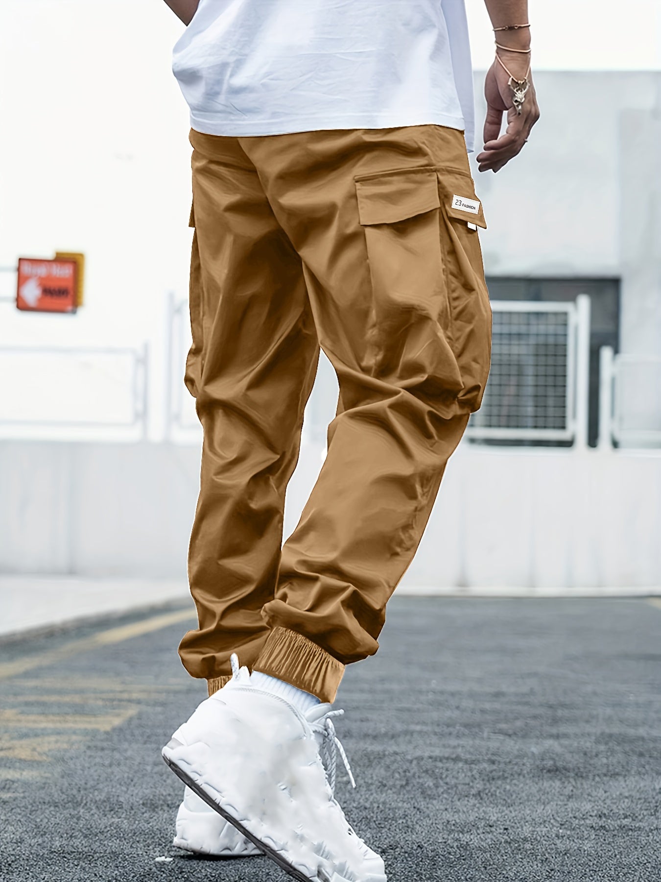 Men's plus-size cargo pants with letters print, multiple pockets, ideal for outdoor activities.