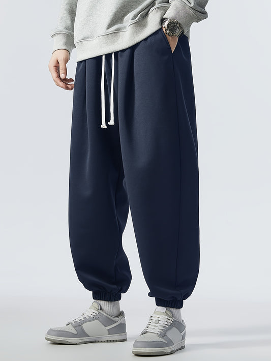 Loose fit, striped sweatpants for men, plus size, made of polyester blend with elastic waistband and drawstring. Machine washable for year-round comfort.