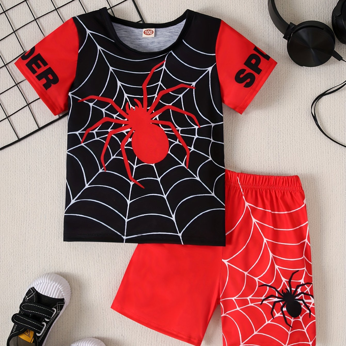 Boys 2-piece casual outfit set with spider web print tee and shorts for summer wear.