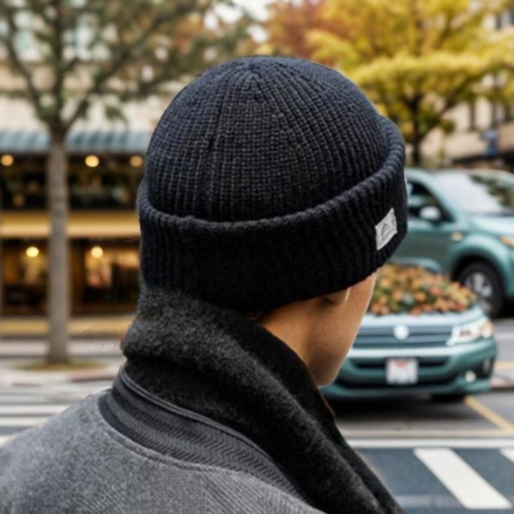 Stay warm and stylish in the winter with this knit beanie that features an integrated face mask. Made with windproof and warm fleece, it is perfect for outdoor activities such as cycling during the autumn season.