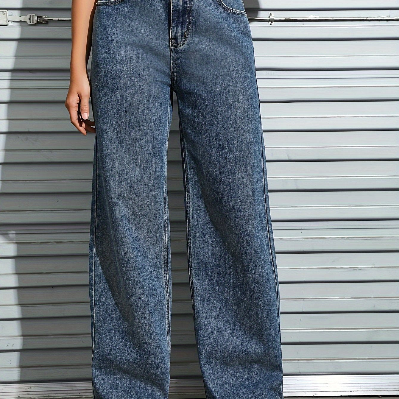 Women's plain washed blue loose fit jeans with slash pockets, perfect for casual autumn wear.