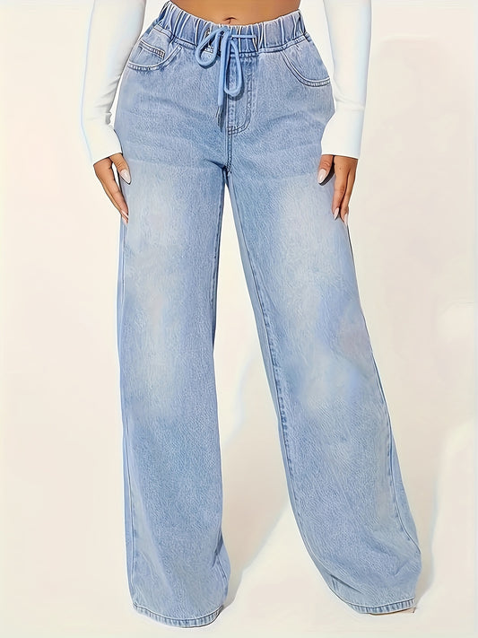 Washed blue drawstring jeans for casual fall style.