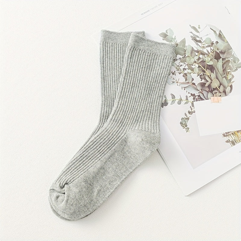 Men's solid color socks in a multi-pack of 2 or 5 pairs, breathable mid-calf sports socks suitable for all seasons. Trendy and boneless design.