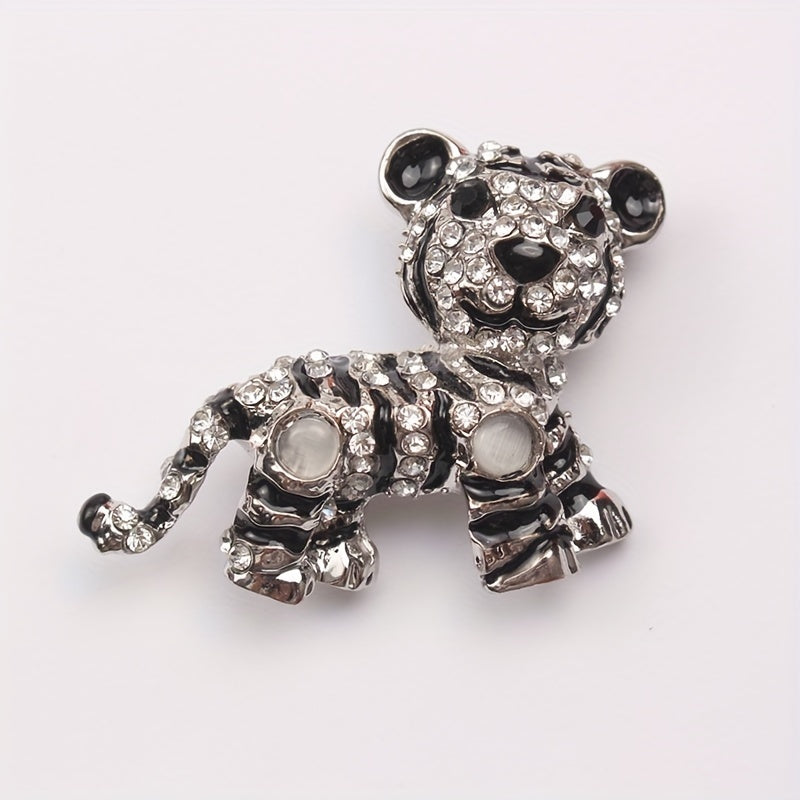 Irregularly shaped, vintage tiger brooch pin with rhinestone accent features a cute tiger design, perfect for men's suit jacket lapels.