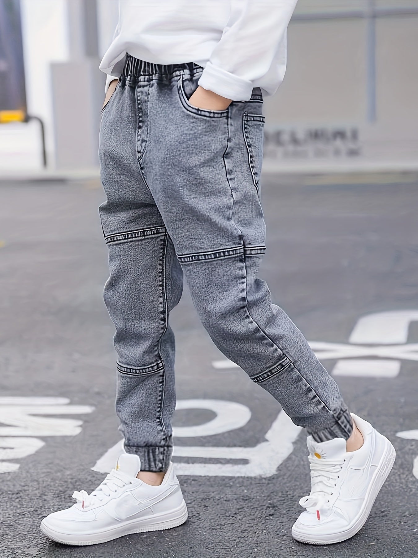 Boys' versatile denim pants with patch detailing for all seasons.