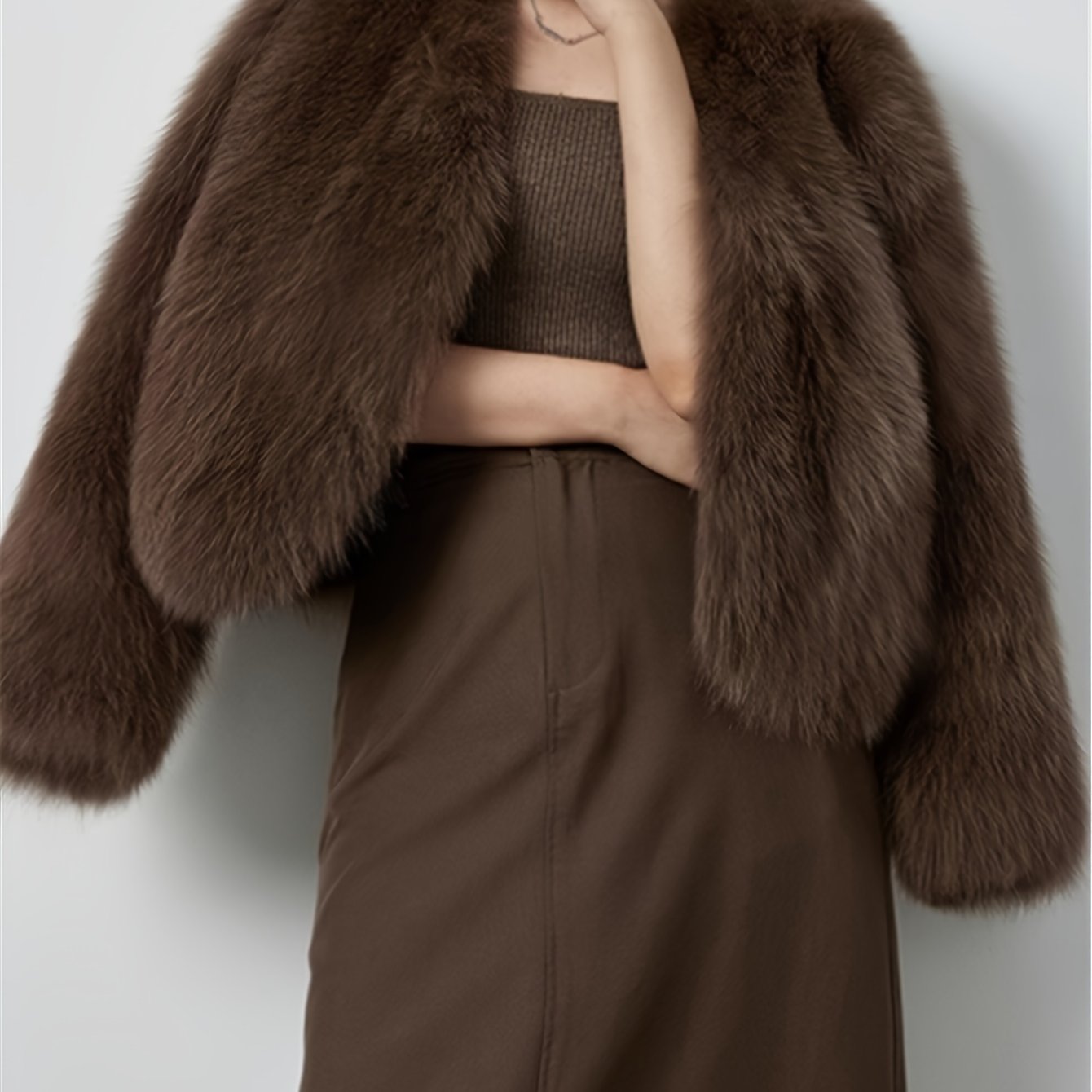 Elegant faux fur trim jacket in light beige/blonde for women. Made of soft polyester material, perfect for cold weather. Features a chic style with long sleeves and classic collar design.