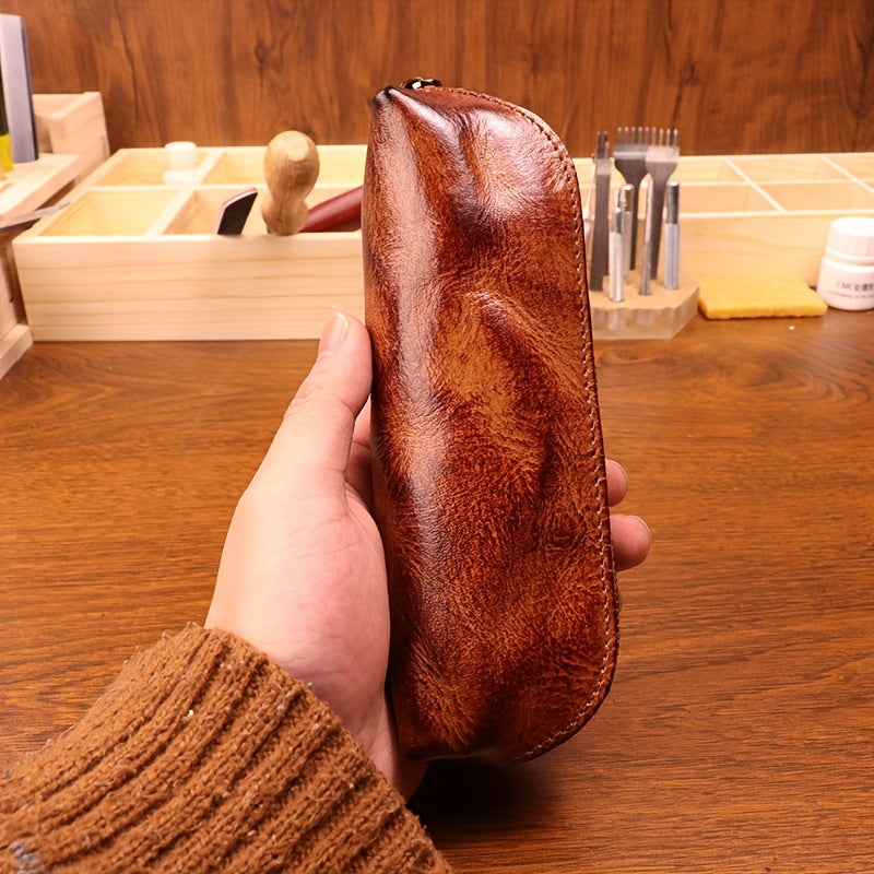 Full-grain leather glasses cases handcrafted in a vintage style, featuring distressed plant-tanned leather. These rustic eyewear storage pouches are equipped with a zipper closure for added security.