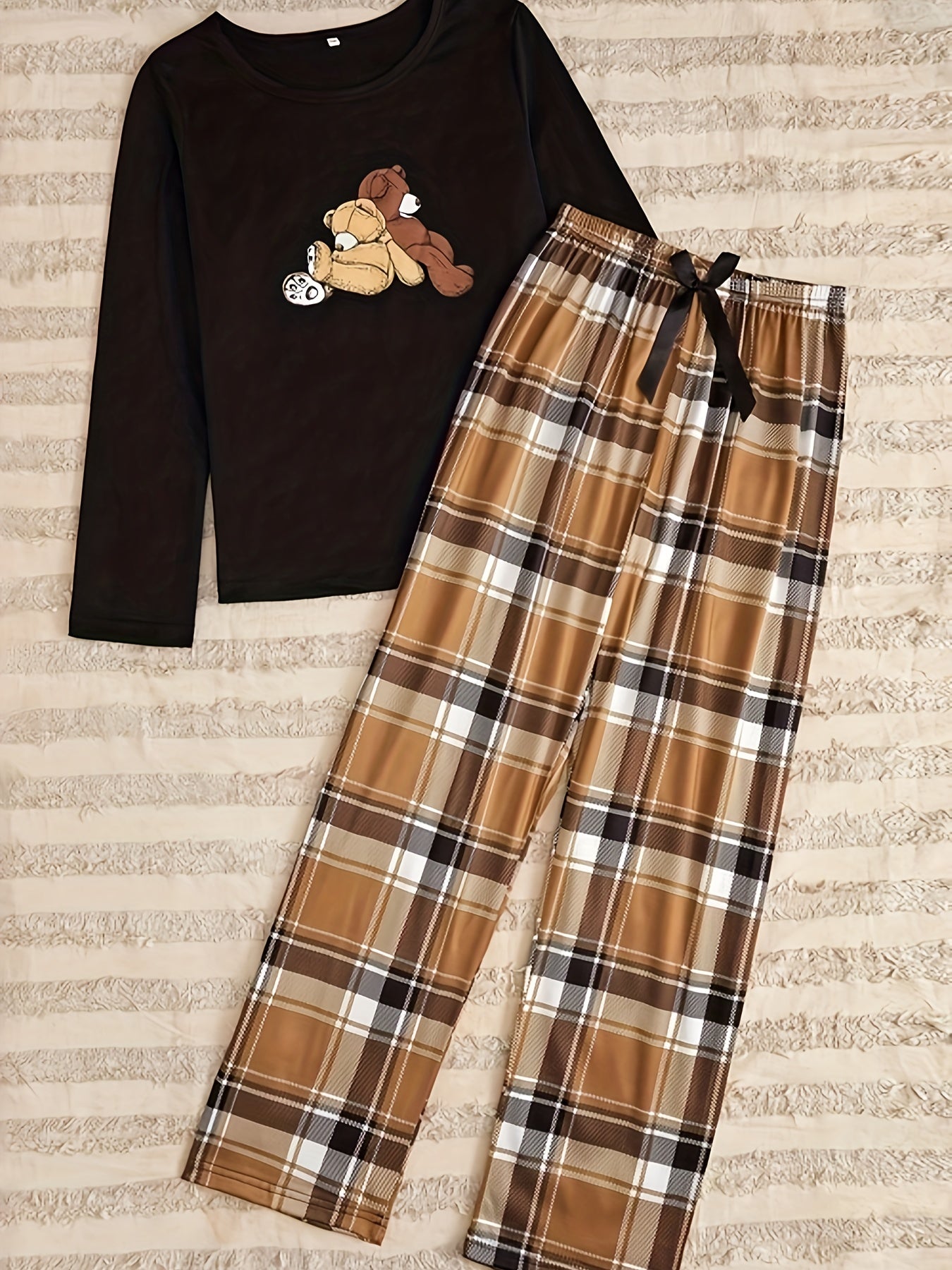 Teddy bear print pajama set featuring long sleeve top and plaid pants for women's sleepwear.