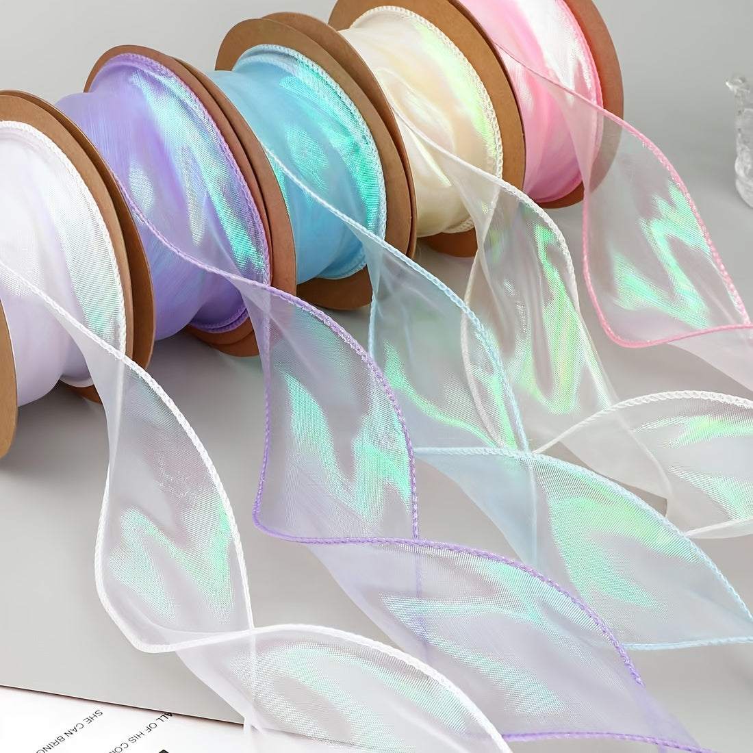 1 roll of 9.14 meter iridescent mermaid tail organza ribbon with holographic wave edge design in assorted colors for DIY crafts, bouquets, gift wrapping, and decorations, ideal for Christmas, Easter, and Valentine's Day.