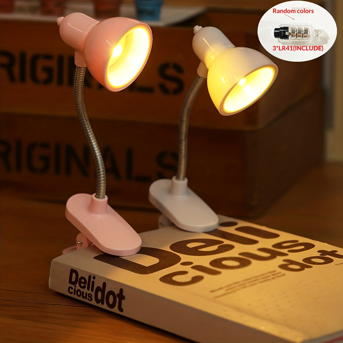 Mini portable LED book light with adjustable arm, warm light for night reading.