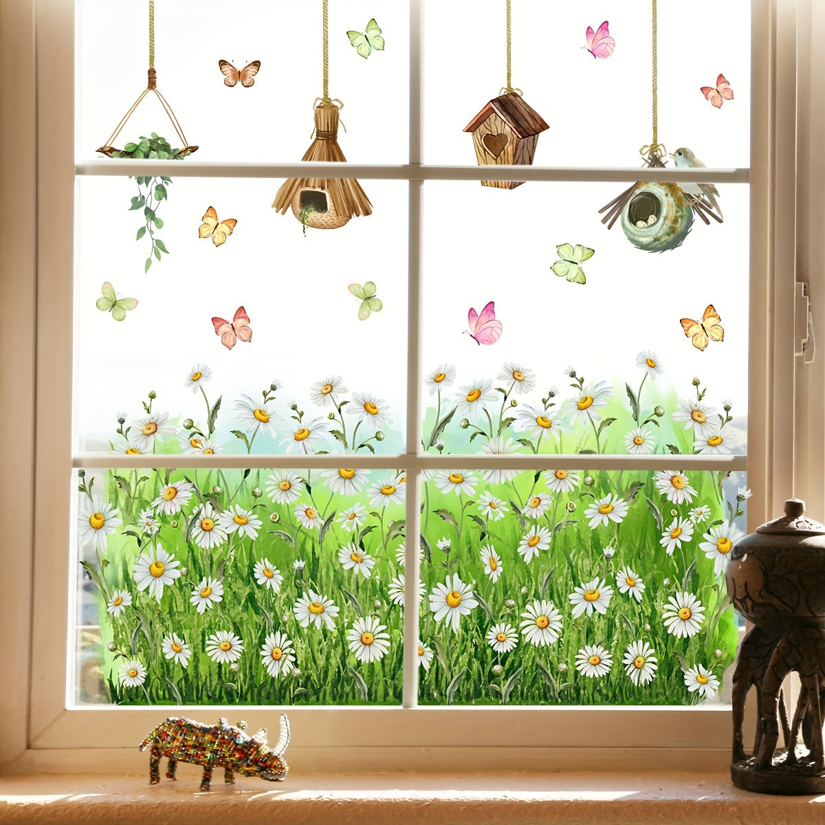 Decorate your living room, bedroom, or home with our charming Daisy & Butterfly Window Clings. These reusable electrostatic decals are perfect for adding a touch of whimsy to your decor. Pair them with our birdcage and glass accessories for a complete